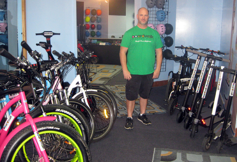 Owner, Dan Borelli inside the office of Boardwalk Electric Rides